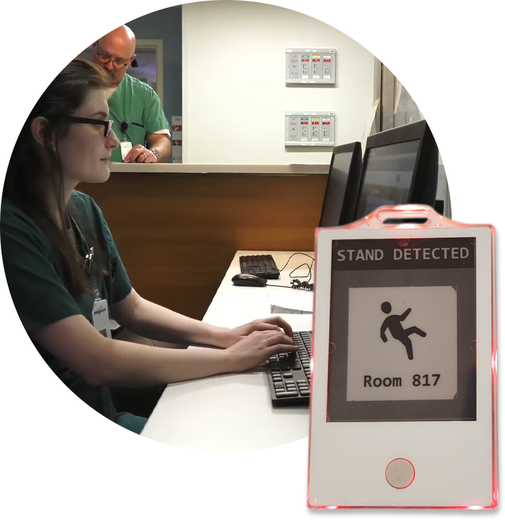 circle-nurse-badge-alarm Nurse at workstation with example of palarum badge alert
